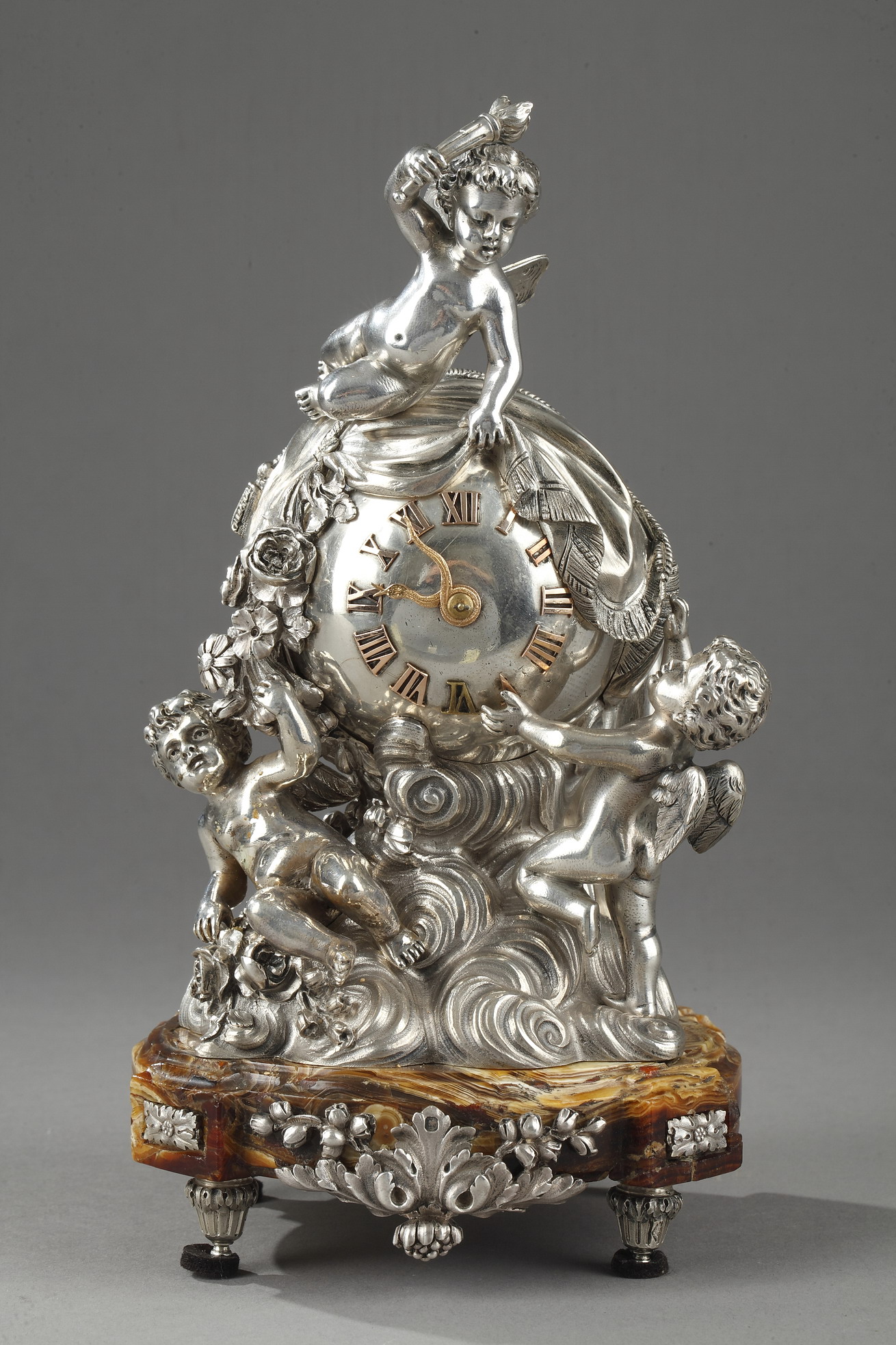 A 19th Century French Silver clock table and onyx base